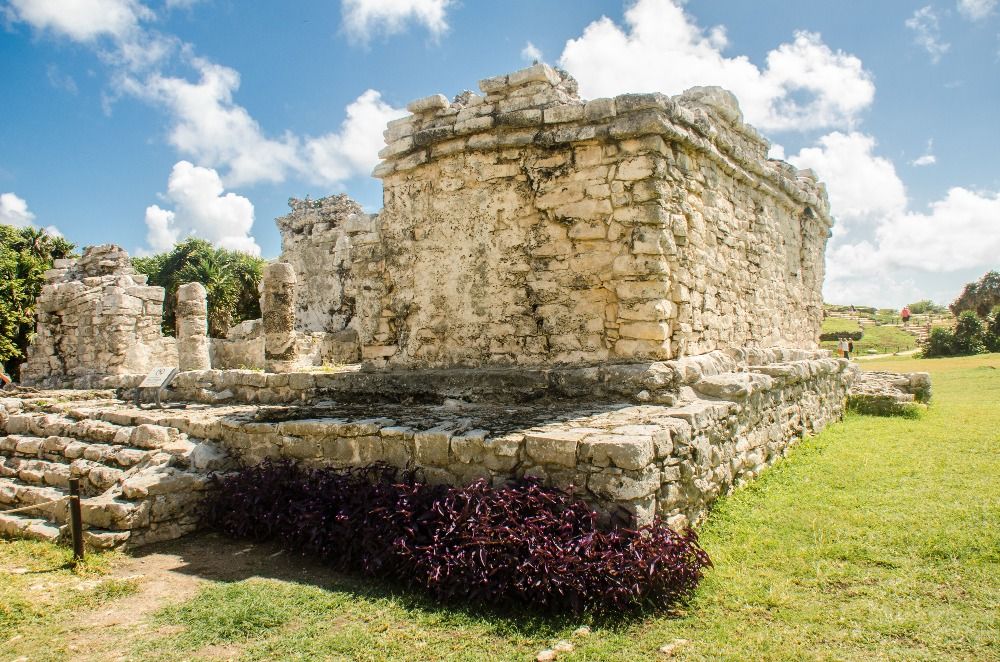 A breathtaking view of the ancient ruins of Tulum overlooking the turquoise waters of the Caribbean Sea.